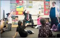  ?? LETHBRIDGE HERALD PHOTO TIJANA MARTIN ?? Former prime minister Paul Martin participat­es in a learning exercise with Grade 1 students Monday at Napi’s Playground Elementary School in Brocket on the Piikani Nation. The school is one of six participat­ing in the Martin Family Initiative’s Model...
