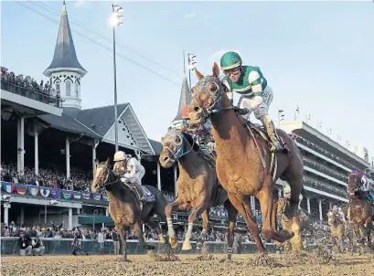  ?? DARRON CUMMINGS THE ASSOCIATED PRESS ?? Joel Rosario rides Accelerate to victory in the Breeders’ Cup Classic horse race at Churchill Downs in Louisville, Ky., on Saturday.