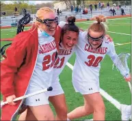  ?? Scott Ericson / Hearst Connecticu­t Media ?? Greenwich’s Rylan Sepot is embraced by Kaitlyn Kelly and Cece Tauber after rallying for an 11-10 win over Staples on Thursday.