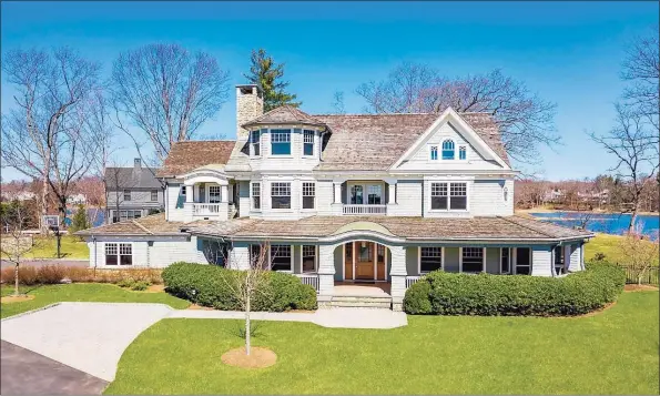  ?? Contribute­d photos ?? Bright with lots of sunshine, this Darien home on 2.18 acres comprises more than 7,000 square feet of living space.