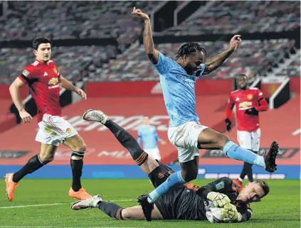  ?? PHOTO: GETTY IMAGES ?? Thwarted . . . Manchester United’s Raheem Sterling has a shot saved by Manchester United goalkeeper Dean Henderson in the English League Cup semifinal at Old Trafford yesterday.