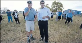  ??  ?? FRONTING UP: Primary Industries Minister Nathan Guy, with farmer David Meads, faces media after declaring Northland a drought zone. Mr Guy says the Government is investing about $400 million in irrigation projects.