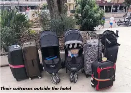  ??  ?? Their suitcases outside the hotel