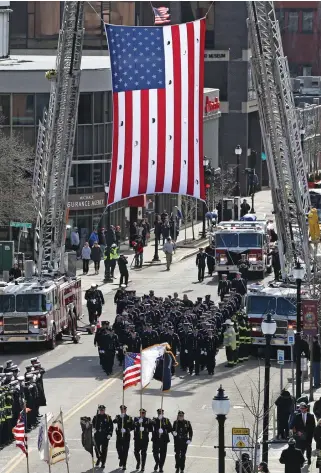  ??  ?? ‘VERY GRATEFUL’: A color guard and Watertown firefighte­rs take part in the funeral procession of Watertown firefighte­r Joseph A. Toscano, top.