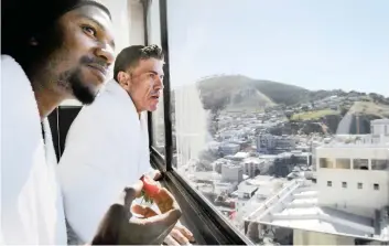  ?? PICTURE: ARMAND HOUGH/ANA ?? VIEW FOR THE NIGHT: Danny Oosthuizen and Thabang Motshwene, both homeless, inspect the view from the room where they spent the night. The Tsogo Sun Hotel group invited Oosthuizen and three of his homeless friends – Charlene Matafin, Natalie Smith and...