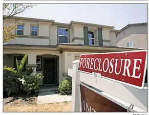  ?? AP file photo ?? A foreclosed home in Sacramento, Calif., is shown in July 2008, after home values plummeted when the housing bubble burst in 2007.