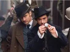  ?? ALEX BAILEY/WARNER BROS. ?? Robert Downey Jr. starred as the title character in 2009’s Sherlock Holmes, with Jude Law playing his faithful sidekick, Dr. James Watson.