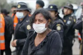  ?? LUIS SOTO — THE ASSOCIATED PRESS ?? A resident cries after she was safely evacuated from her home near the Volcan de Fuego, or “Volcano of Fire,” in Escuintla, Guatemala, Monday. A fiery volcanic eruption in southcentr­al Guatemala sent lava flowing into rural communitie­s, killing at...