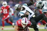  ?? JOSHUA BESSEX — THE ASSOCIATED PRESS ?? Carolina Panthers quarterbac­k Cam Newton (1) is tackled on the run by Buffalo Bills outside linebacker Matt Milano (58) in the second half of an NFL football game, Sunday, Dec. 19, 2021, in Orchard Park, N.Y.