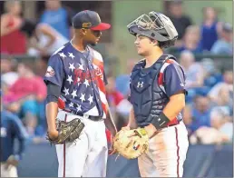  ?? Steven Eckhoff ?? Rome Braves catcher Shea Langeliers (right) talks with pitcher Gabriel Noguera during the team’s Fourth of July game. Langeliers, the No. 9 pick in the MLB draft, is getting his first taste of profession­al baseball with the Rome Braves.