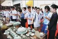  ?? LI ZIHENG / XINHUA ?? Youth representa­tives from 12 member and observer countries of the Shanghai Cooperatio­n Organizati­on visit the Qingdao Internatio­nal Convention Center in Qingdao, Shandong province, on Monday. The youths were participat­ing in the ongoing SCO Youth...