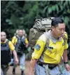  ?? PHOTO: REUTERS ?? A Chinese rescue team arrives near the Tham Luang cave complex on Saturday.