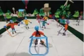  ??  ?? The North Pole in origami with Santa Claus, left, and one of two hockey games on three sheets of ice.