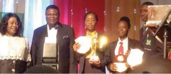  ??  ?? L-R: Wife of Bishop Mike Okonkwo, Mrs. Peace Okonkwo, the Celebrant, Bishop Mike Okonkwo, the overall winner in the 2017 Mike Okonkwo National Essay Competitio­n, Miss Alexandra Nwigwe, second position, Miss Jesuountan Mercy Ipinmoye and third position,...