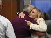  ?? ROBIN BUCKSON — DETROIT NEWS VIA AP ?? Oakland County prosecutor Karen McDonald hugs Steve St. Juliana, father of Oxford High School shooting victim Hana St. Juliana, following the guilty verdict of James Crumbley in Oakland County Court in Pontiac, Mich., Thursday.