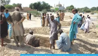  ?? AFP ?? BALOCHISTA­N, Pakistan: Pakistani mourners dig graves for the victims of a suicide blast outside the Sufi shrine in Jhal Magsi district in Balochista­n.—