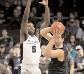  ?? File photo by Louriann Mardo-Zayat / lmzartwork­s.com ?? After scoring 15.7 points on 43.6 percent shooting as a junior, Providence wing Rodney Bullock (5) entered his name in the NBA Draft, but he didn’t sign with an agent.