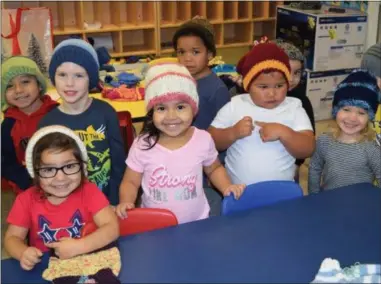  ?? SUBMITTED PHOTO ?? Some of the children at Tick Tock Early Learning Center show off the new hats they received.