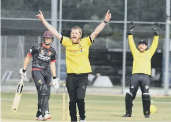  ??  ?? Mark Edwards of Peterborou­gh Town traps Oundle’s Conor Craig lbw for 13. Photo: David Lowndes.