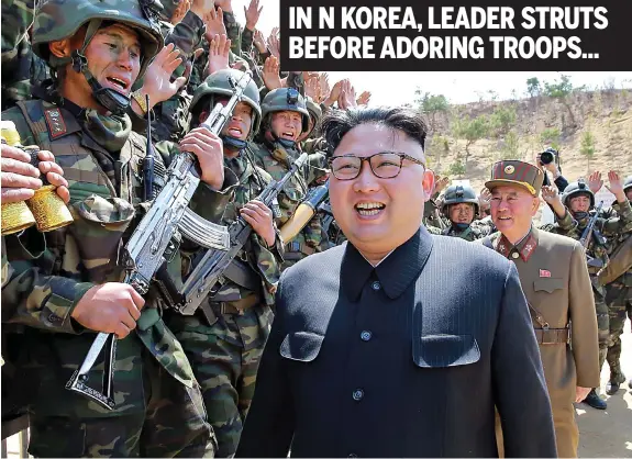  ??  ?? Fanatical: North Korean dictator Kim Jong-un inspects a wildly cheering crowd of his soldiers as the tension with America mounts IN N KOREA, LEADER STRUTS BEFORE ADORING TROOPS...