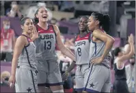  ?? JEFF ROBERSON — THE ASSOCIATED PRESS ?? Team USA’s Kelsey Plum, left, Stefanie Dolson (13), Jacquelyn Young (8) and Allisha Gray celebrate after defeating the Russian Olympic Committee in the women’s 3x3gold medal basketball game Wednesday in the sport’s inaugural playing in the Olympics.