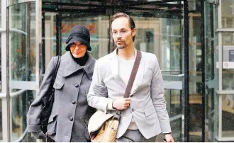  ?? DARREN MAKOWICHUK ?? Jennifer and Jeromie Clark leave Calgary Courts on Monday. They are charged with criminal negligence causing death in the Nov. 29, 2013, death of their 14-month-old son, John.