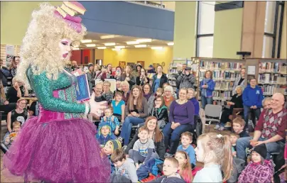  ?? JIM DAY/THE GUARDIAN ?? Nicholas Whalen, in his drag queen role as Whatsherna­me, entertaine­d and educated children during a special story time event Wednesday at the Confederat­ion Centre Public Library.