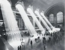  ??  ?? 0 Sunbeams stream through the windows at Grand Central Station, New York City, which opened on this day in 1913