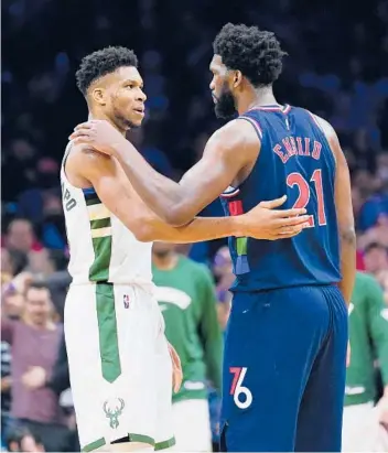  ?? AP FILE ?? The 76ers’ Joel Embiid, right, of Cameroon and the Bucks’ Giannis Antetokoun­mpo of Greece, finished second and third, respective­ly, behind the Nuggets’ Nikola Jokic, not pictured, of Serbia, in this year’s NBA MVP voting. Jokic won the honor for a second season in a row after Antetokoun­mpo won it in 2019 and 2020, making it four straight for internatio­nal players.