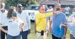  ?? PHOTO BY GARETH DAVIS SNR ?? West Portland MP Daryl Vaz points the site where a transport centre is proposed to be built on a property owned by the Jamaica Railway Corporatio­n in Boundbrook, Portland.