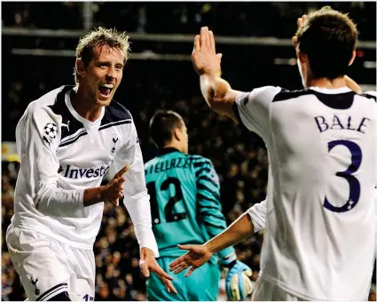  ?? AFP ?? Highlight: Crouch runs to Gareth Bale after scoring in Spurs’ win over Inter Milan in 2010