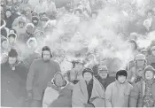  ?? ASSOCIATED PRESS FILE PHOTO ?? Fans watch the Packers play the Cowboys in the NFL Championsh­ip game Dec. 31, 1967, in Green Bay, Wis. Simply dubbed the ‘Ice Bowl,’ those who participat­ed in the game that day at Lambeau Field still shiver when talking about it.