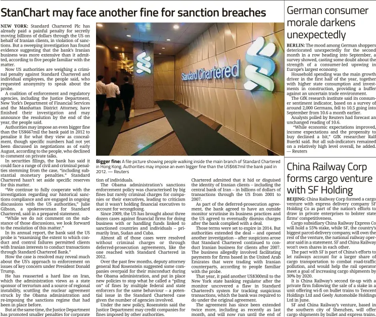  ??  ?? Bigger fine: A file picture showing people walking inside the main branch of Standard Chartered in Hong Kong. Authoritie­s may impose an even bigger fine than the US$667mil the bank paid in 2012. — Reuters