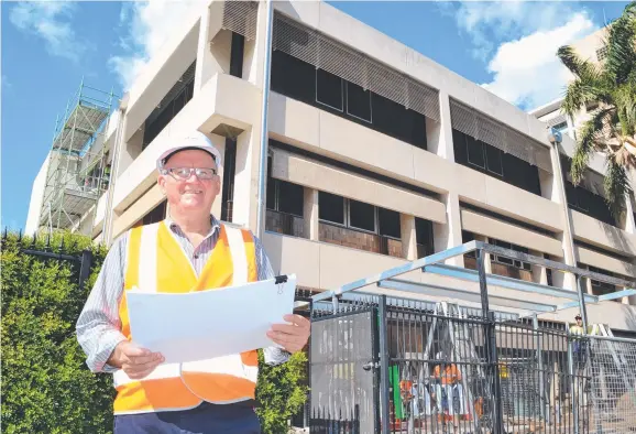  ??  ?? NEW ROLE: Woollam Constructi­ons North Queensland manager Gary Inness at the Townsville Private Hospital project in Wills Street in the CBD.