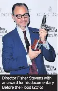  ??  ?? Director Fisher Stevens with an award for his documentar­y Before the Flood (2016)