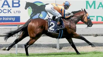  ?? TRISH DUNELL ?? Sword Of State provides Troy Harris with an armchair ride as he cruises home to win the Group III Waikato Stud Slipper (1200m) at Matamata.