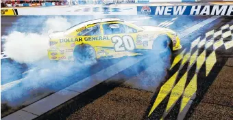  ?? THE ASSOCIATED PRESS ?? Matt Kenseth celebrates at the finish line after winning Sunday’s Sylvania 300 at New Hampshire Motor Speedway in Loudon, N.H.