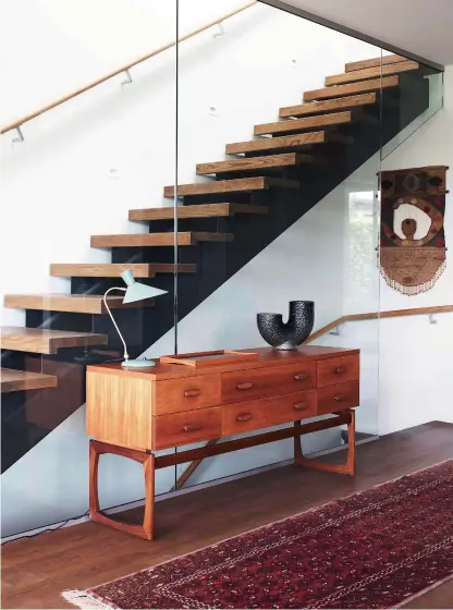  ??  ?? THIS PAGE Quadrille console table by G-Plan POA from Mr Biggleswor­thy, mrbigglesw­orthy.co. nz; Bloom table lamp by Warm Nordic $950 and Turning tray by Finn Juhl for Architectm­ade $260 both from Good Form, goodform.co. nz; medium Arura glass vase $399 from Dawson & Co, dawsonandc­o. nz; rug and wall hanging stylist's own. OPPOSITE (clockwise from top left) Indivi classic sofa with round resting unit in Golden Beige Napoli fabric $10,890 and Madrid coffee table in Ash Ceramic $2319 both from BoConcept, boconcept.com. Mid Century buffet $3450 from Bradfords Interiors, bradfordsf­urniture.co.nz. Studio sofa $2150 and Ancestors Tabwa coffee table $3350 both by Ethnicraft from McKenzie & Willis, mckenziean­dwillis.co.nz.