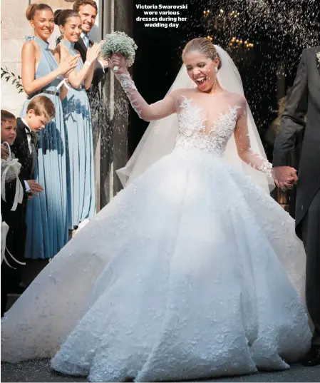  ??  ?? Victoria Swarovski wore various dresses during her wedding day