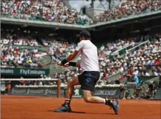  ?? PETR DAVID JOSEK, THE ASSOCIATED PRESS ?? Britain’s Andy Murray plays a shot Monday against Russia’s Karen Khachanov. Murray won, 6-3, 6-4, 6-4.