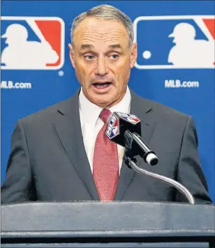  ?? THE ASSOCIATED PRESS/CHARLES REX ARBOGAST ?? Baseball Commission­er Rob Manfred responds to a question following the two-day meeting of Major League Baseball owners Thursday in Chicago.