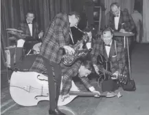  ??  ?? 0 Rock Around the Clock by Bill Haley and the Comets topped the Billboard chart on this day in 1955