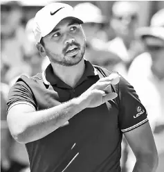  ??  ?? Jason Day acknowledg­es the applause after his first round at the Australian Open at the Australian Golf Club course in Sydney. — AFP photo