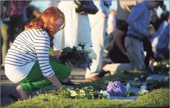  ?? Hearst Connecticu­t Media file photo ?? Emma Hunt, 12, of Essex, places flowers on her father’s name at Connecticu­t’s 9/11 Living Memorial in Westport on Sept. 10, 2012. William Christophe­r Hunt, of Norwalk, died in 2 Tower World Trade Center. Below, a rose is laid at the stone of Ronald Gilligan, of Norwalk, on Sept. 5, 2019.