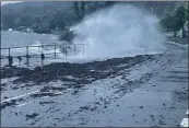  ?? ?? Waves crash over the sea wall in Ardrishaig as Storm Barra hits.