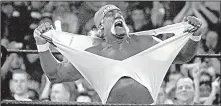  ?? AP FILE PHOTO ?? Profession­al wrestler Hulk Hogan spent time mingling with Philadelph­ia Phillies fans, players and coaches Friday when he made an appearance at the Phillies’ Grapefruit League game against the Pittsburgh Pirates. He also said he would drop a leg on WWE...