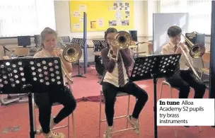  ??  ?? In tune Alloa Academy S2 pupils try brass instrument­s