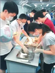  ?? PHOTOS PROVIDED TO CHINA DAILY ?? Residents trained at the First Affiliated Hospital of Sun Yat-sen University check out surgical tools.