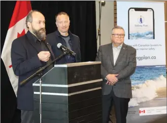  ?? ANDREA PEACOCK/The Daily Courier ?? From left, Nelson Jatel, CEO of LRC Consulting Solutions, Kelowna-Lake Country MP Stephen Fuhr and Ralph Goodale, minister of public safety and emergency preparedne­ss, announce a federally funded boat safety app Thursday in Kelowna. Kelowna-based LRC Consulting Solutions received $595,000 from the federal government to develop the app, which will be available next year.