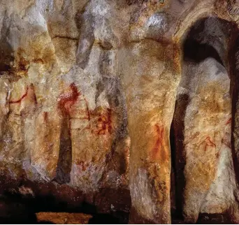  ??  ?? Paintings on a section of the La Pasiega cave wall in Spain which pre-date modern humans by many thousands of years